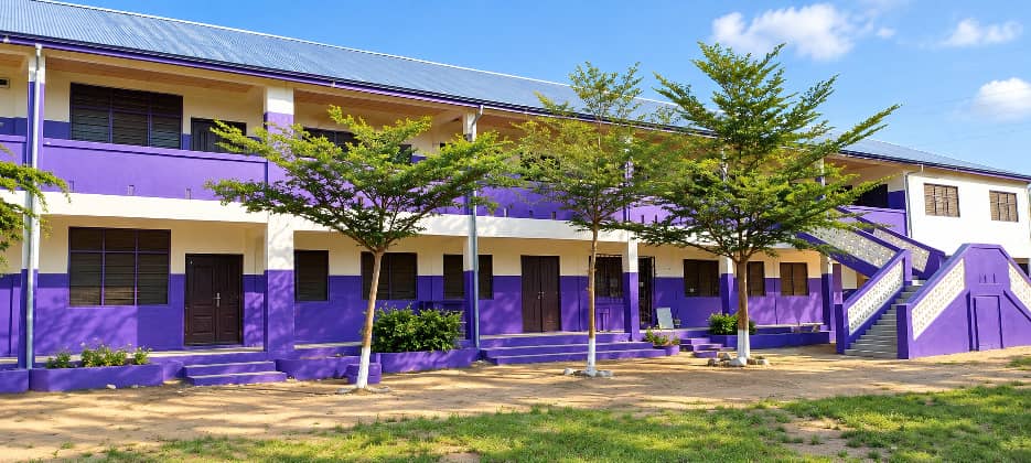 Front view of the school classroom block with verandas and staircases